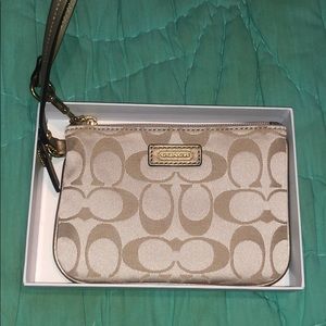 New never used Coach signature tan zip wristlet